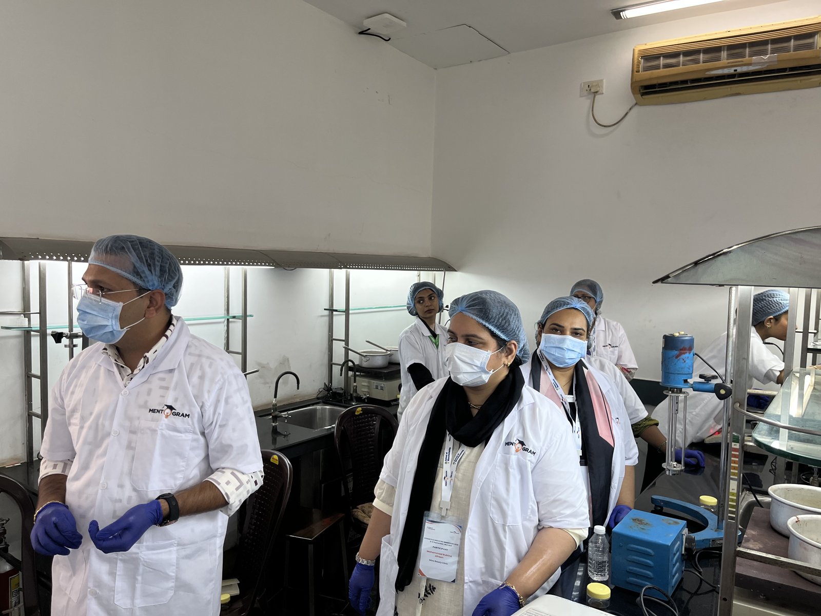 Participants observing a laboratory demonstration