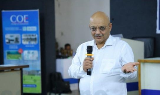 Speaker addressing participants at the previous summit