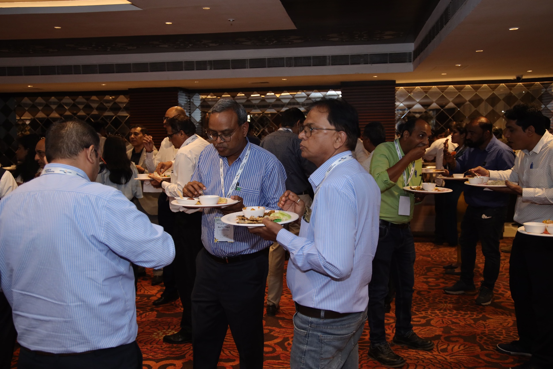 Industry leaders networking at a summit